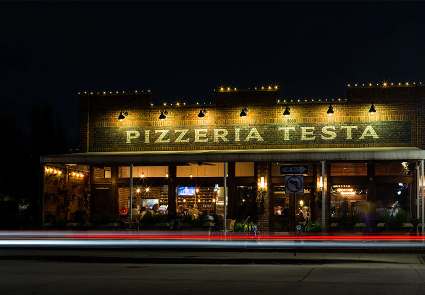 Pizzeria Testa at night in downtown Frisco, TX